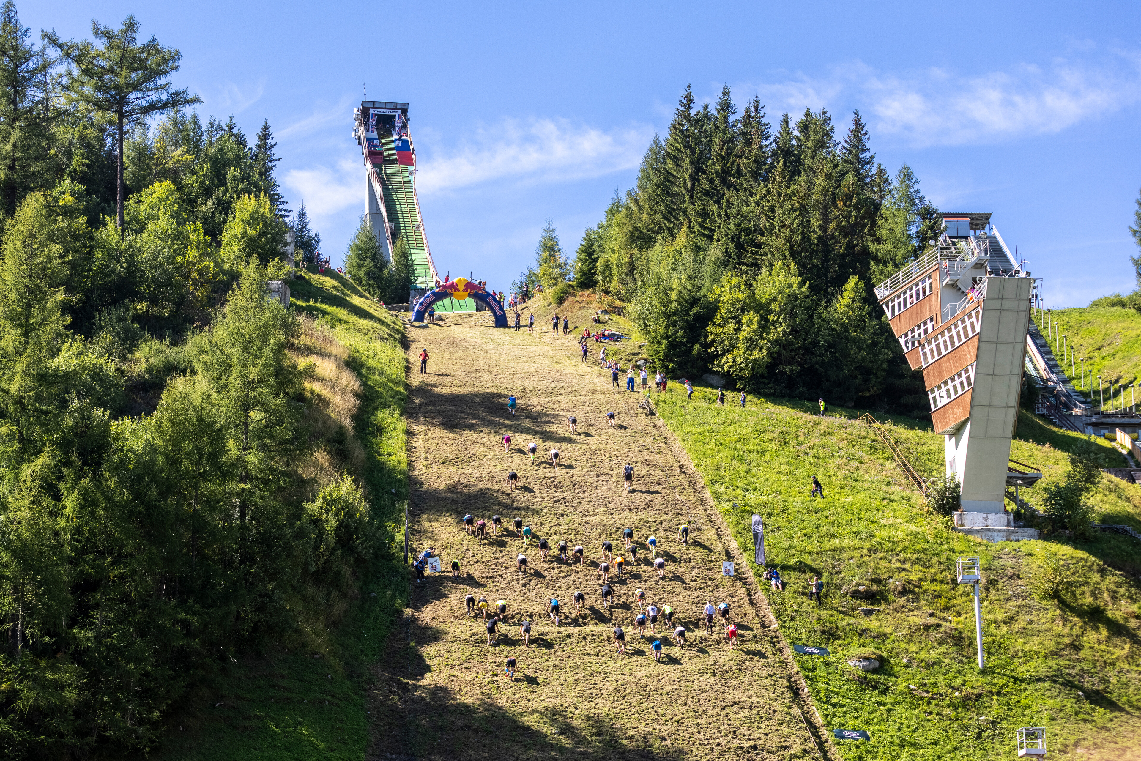 Participants make their way up the 400 meter ski jump HS130 during the Red Bull 400 at Strbske Pleso, Slovakia on September 11, 2021. // Filip Nagy / Red Bull Content Pool // SI202109120643 // Usage for editorial use only //